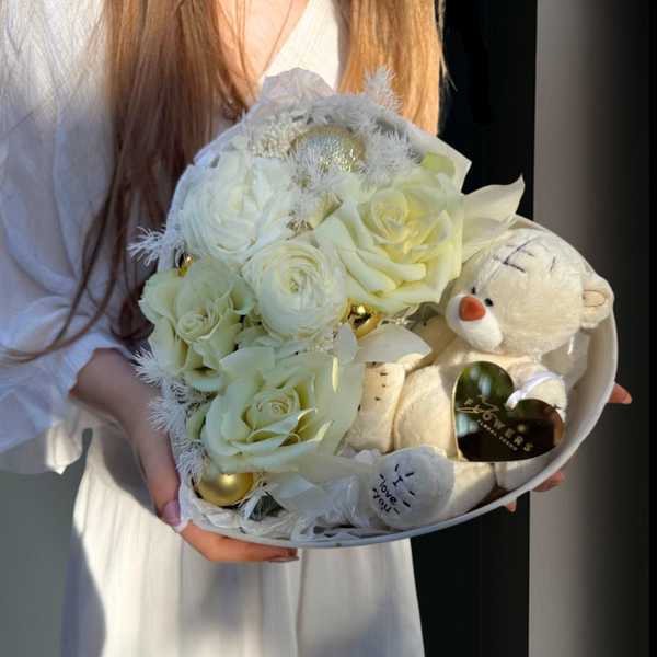 Bouquet of white flowers with a plush toy 