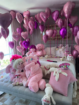 Sweet 16 birthday room decoration with pink and purple heart balloons, giant plush teddy bears, and white bunny toys — Miami same-day delivery